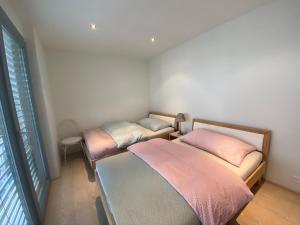 Postel nebo postele na pokoji v ubytování bnb Valais - by La Sittelle