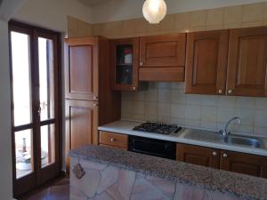 Ett kök eller pentry på Great Apartment Stintino