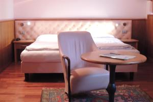 Postel nebo postele na pokoji v ubytování Grand Hotel Astoria