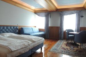 Postel nebo postele na pokoji v ubytování Grand Hotel Astoria