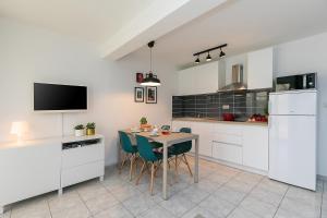 Kuchyň nebo kuchyňský kout v ubytování Apartments Dama