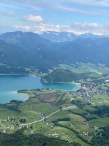 an aerial view of a town and a lake at Fumerhof in Strobl