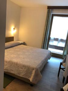 Postel nebo postele na pokoji v ubytování Hotel Nevada + 17 fotografií