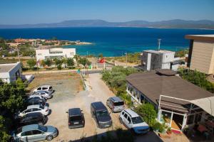 a bunch of cars parked in a parking lot at Huzur Hotel in Siğacık +20 photos