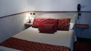 Letto o letti in una camera di Hotel Mignon