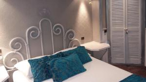 Letto o letti in una camera di Hotel Mignon