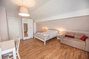 Postel nebo postele na pokoji v ubytování Ioannis Apartments