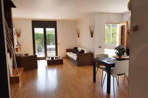 a living room with a couch and a table at MAS BLANC in Calafell