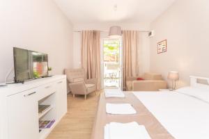 Postel nebo postele na pokoji v ubytování Ioannis Apartments