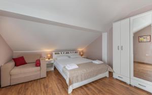 Postel nebo postele na pokoji v ubytování Ioannis Apartments