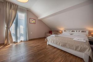 Postelja oz. postelje v sobi nastanitve Ioannis Apartments
