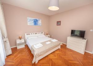 Postel nebo postele na pokoji v ubytování Ioannis Apartments