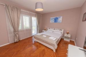 Postel nebo postele na pokoji v ubytování Ioannis Apartments