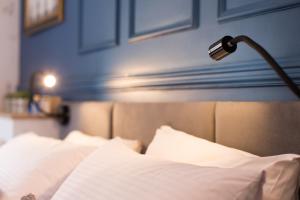 a bedroom with a bed with a lamp on it at Дизайнерські апартаменти на вулиці Краківській 17 в центрі Львова in Lviv