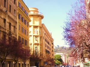 a tall building with a clock tower on top of it at Campanella3 in Rome