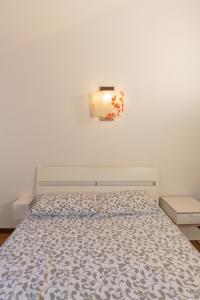 מיטה או מיטות בחדר ב-Guest house Villa Albrizzi Marini