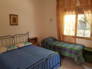 Postel nebo postele na pokoji v ubytování Villa Cino
