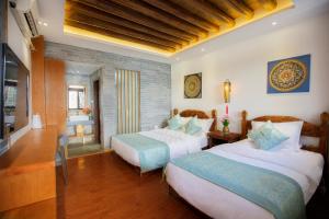 夕露小榭古城南门店 Xilu Xiaoxie Inn Old Town Lijiang客房内的一张或多张床位