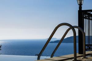 a view of the ocean from a balcony at Hideaway Penthouse Apartment in Kaş