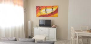a living room with a tv on a white dresser at Vistas para el relax in Puntallana +12 photos