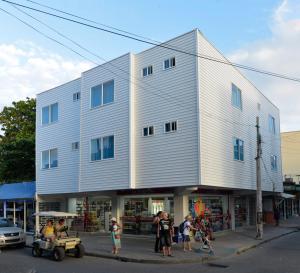 a group of people standing outside of a building at Tropical Breeze Apartamentos in San Andrés