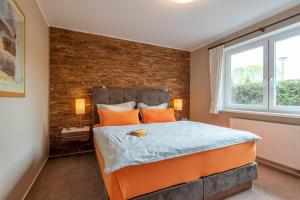 Ένα ή περισσότερα κρεβάτια σε δωμάτιο στο Ferienhaus Lütten Kulli - 1