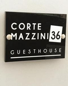 a sign on a wall with the words centre marlinulse at Guest House CorteMazzini36 in Cesenatico