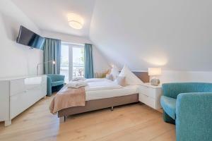 Postel nebo postele na pokoji v ubytování HofHotel Krähenberg + 37 fotografií