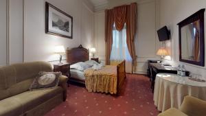 Tempat tidur dalam kamar di Hotel Bursztynowy Pałac