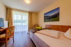 Postel nebo postele na pokoji v ubytování Hotel Neudeck
