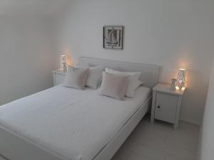 Posteľ alebo postele v izbe v ubytovaní Bella Apartments
