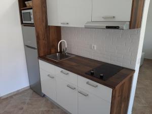 Kuchyňa alebo kuchynka v ubytovaní Bella Apartments