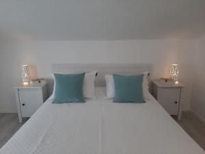 Posteľ alebo postele v izbe v ubytovaní Bella Apartments + 37 fotografií