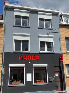 
a building with a sign on the front of it at Panda Bella in Zaventem

