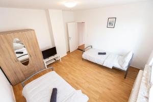 TV a/nebo společenská místnost v ubytování AVR Apartment Geestemunde 3