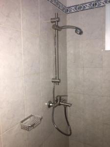 a shower with a shower head in a bathroom at Résidence Comara in Marcory +103 photos