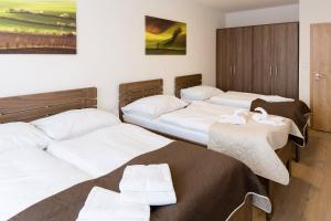 Postel nebo postele na pokoji v ubytování Penzion U Buštíků