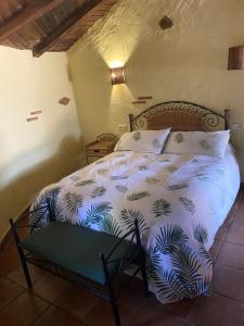 a bedroom with a bed in a room at complejo rural el prado in Logrosán