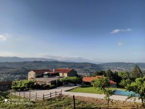 a villa with a swimming pool and a resort at Quinta do Caritel in Vouzela