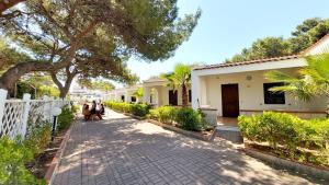 a brick sidewalk in front of a house at Villaggio Camping Oasi in Vieste