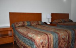 Postel nebo postele na pokoji v ubytování Travel Inn Hotel Simpson Bay