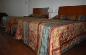 Postel nebo postele na pokoji v ubytování Travel Inn Hotel Simpson Bay