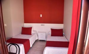 Postel nebo postele na pokoji v ubytování Hostal Playa Candor