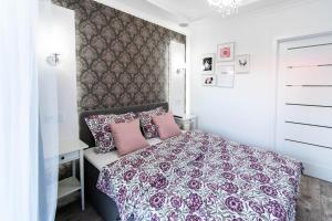 Posteľ alebo postele v izbe v ubytovaní Glam Apartment