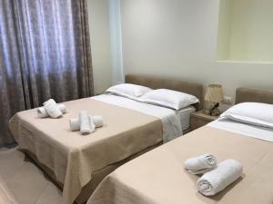 Postel nebo postele na pokoji v ubytování Deni's Hotel