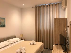 Postel nebo postele na pokoji v ubytování Deni's Hotel