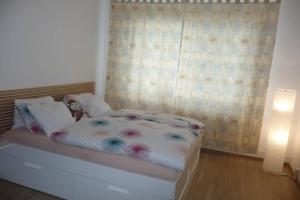 Posteľ alebo postele v izbe v ubytovaní Apartman Q11