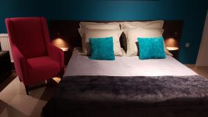 En eller flere senge i et værelse på Villa Lucy