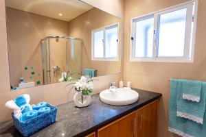 a bathroom with a sink and a mirror at Home Sweet Home in Ribeira Grande +21 photos