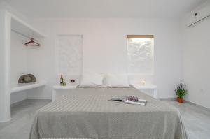 Кровать или кровати в номере Casa Verde Di Naxos